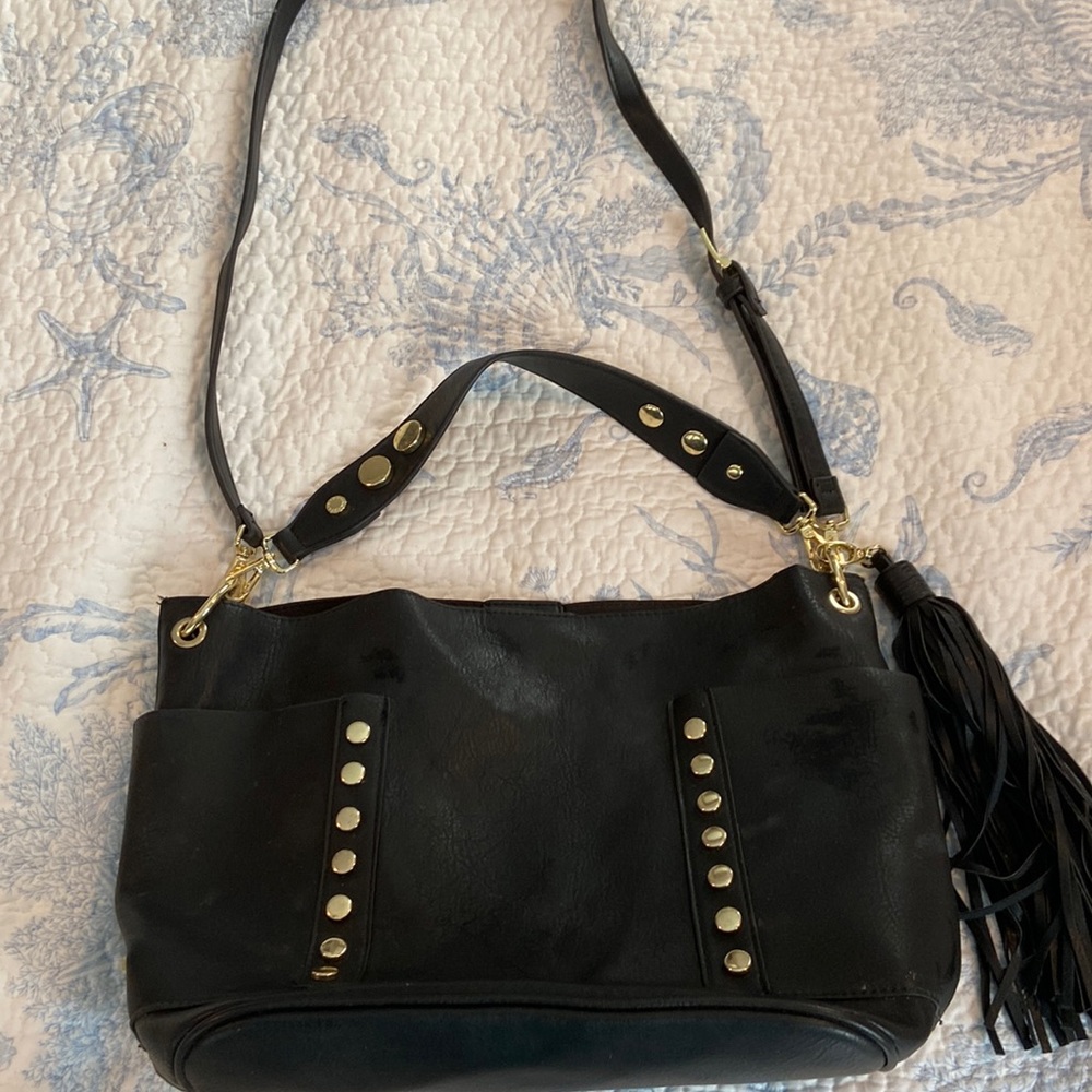 Steve Madden black purse. Crossbody strap, shoulder strap &tassel all removable.
